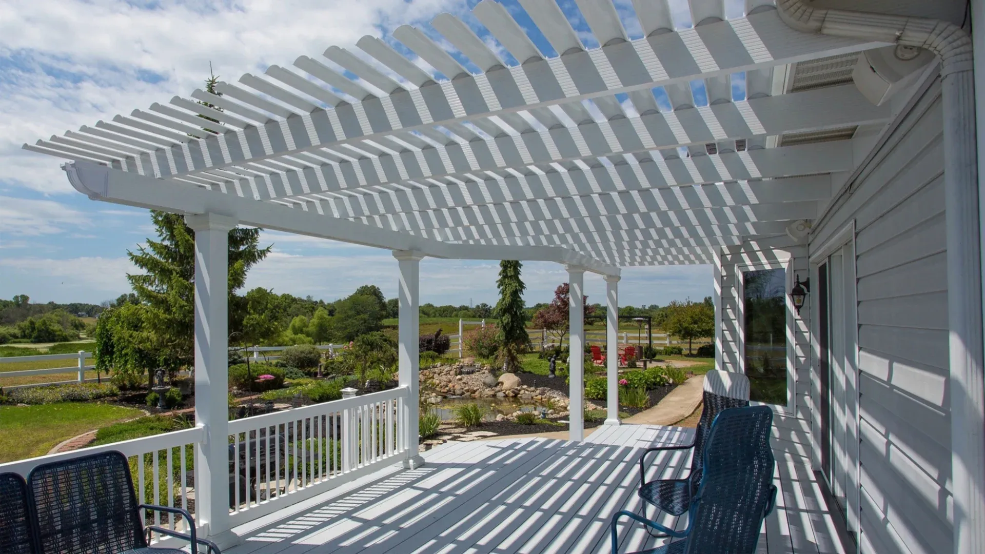 A white pergola over a patio