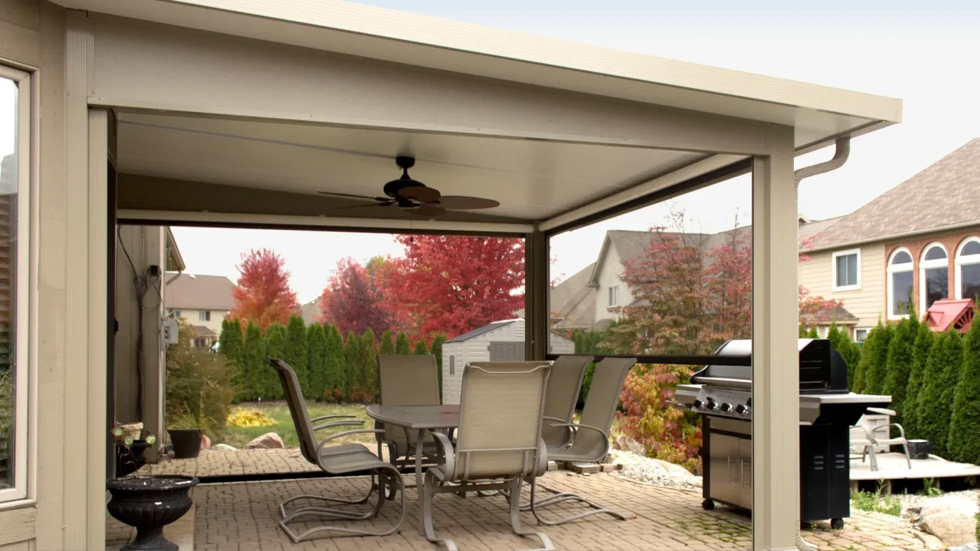 A patio cover over a patio with an outdoor dining set