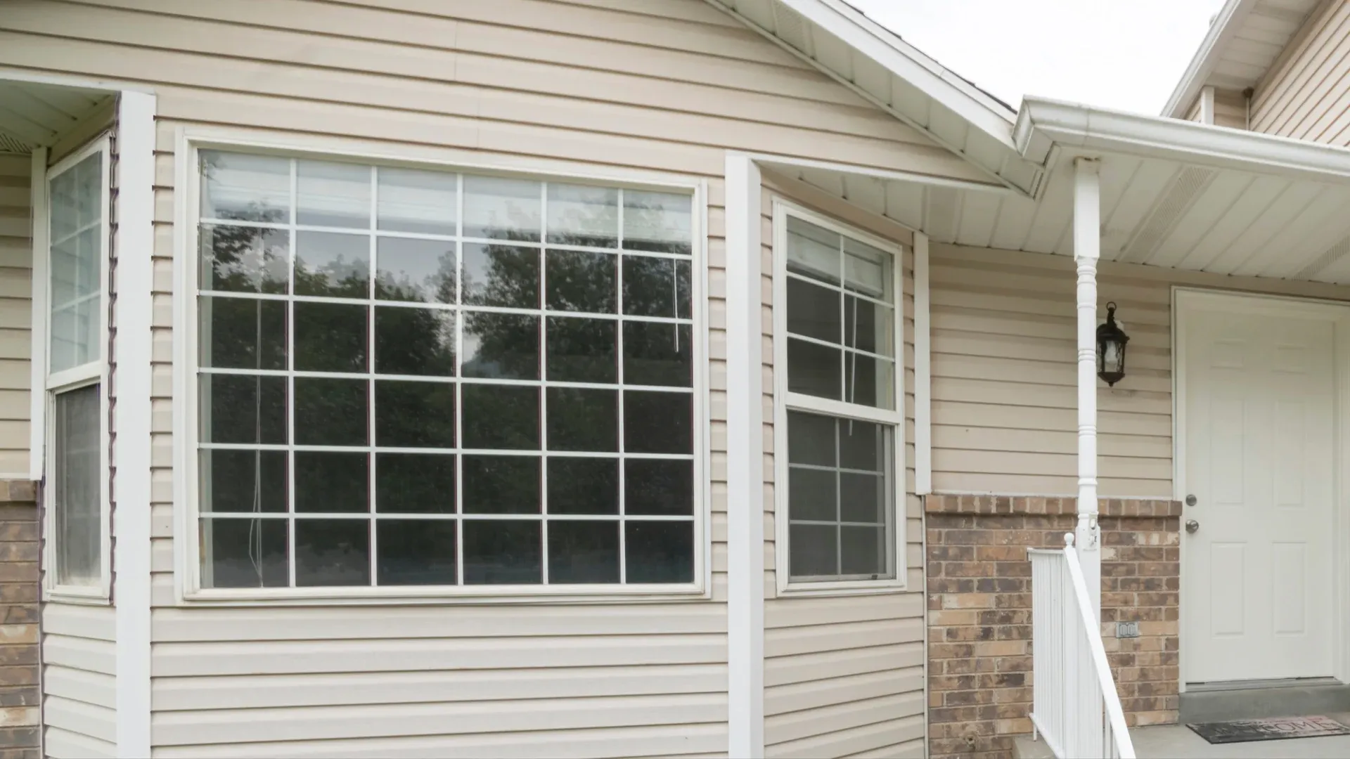 Large windows in a home with beige siding
