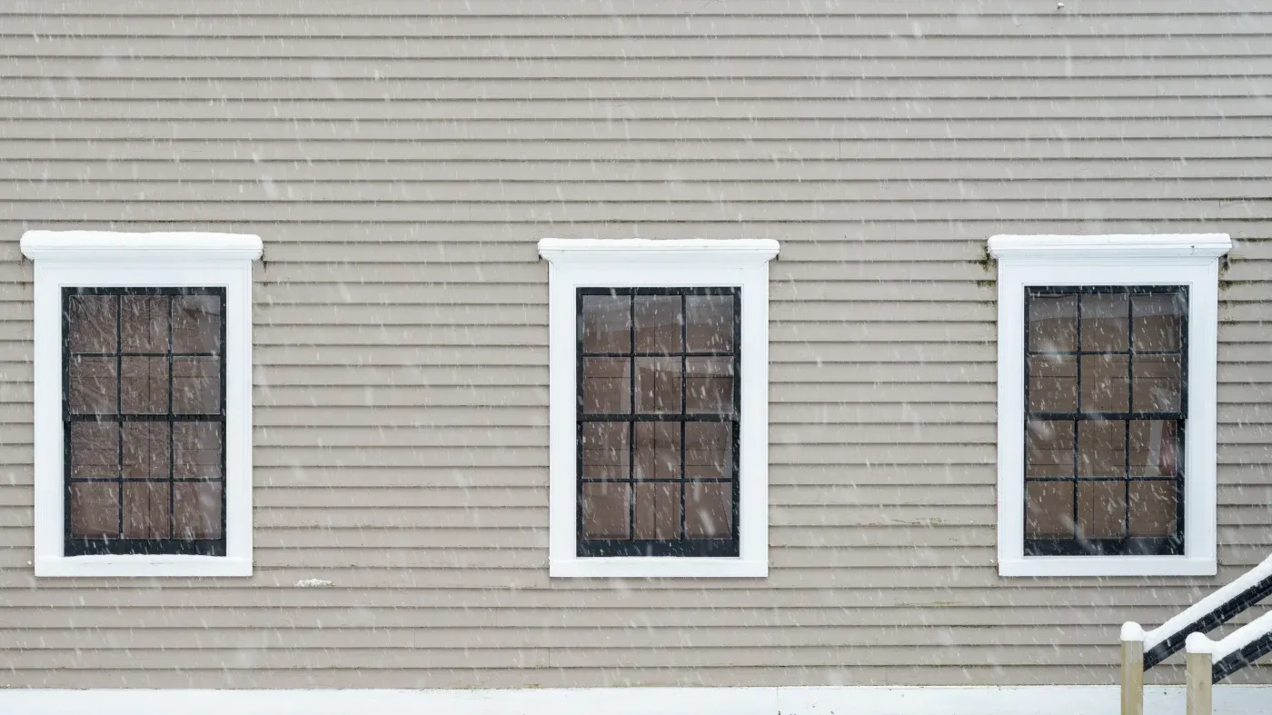 White windows in a home with gray siding